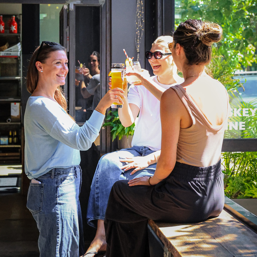 summer cocktail toast in bitter pops taproom